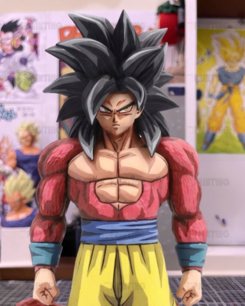 An anime-style collectible figure of Goku in a Super Saiyan form, standing in a room with Dragon Ball posters on the wall behind him.