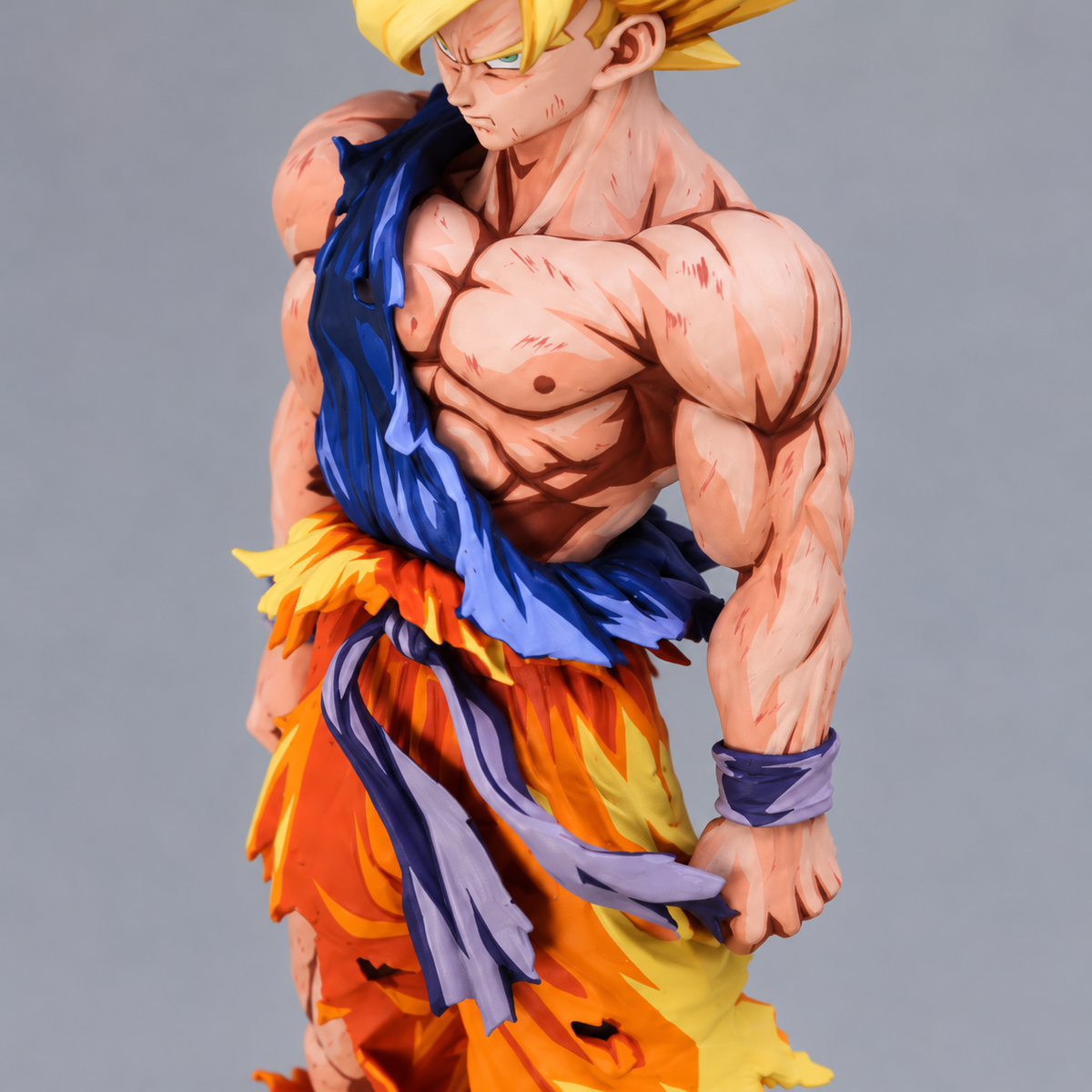 Hand-painted Goku SSJ figure — torso paint detail