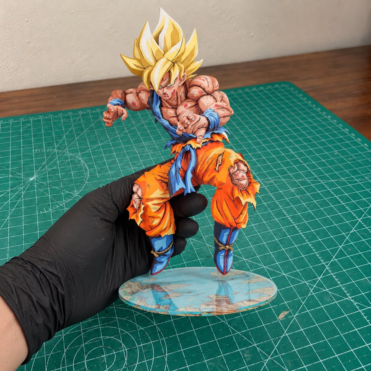 Dragon Ball Super SSJ Son Goku Figure Repaint — painted figure in a miniature painting workshop