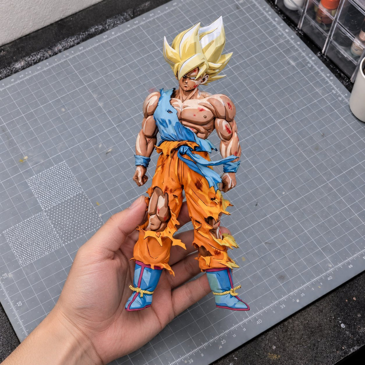 Dragon Ball 2D Anime Colour Namek Goku Figure Repaint — painted figure in a miniature painting workshop