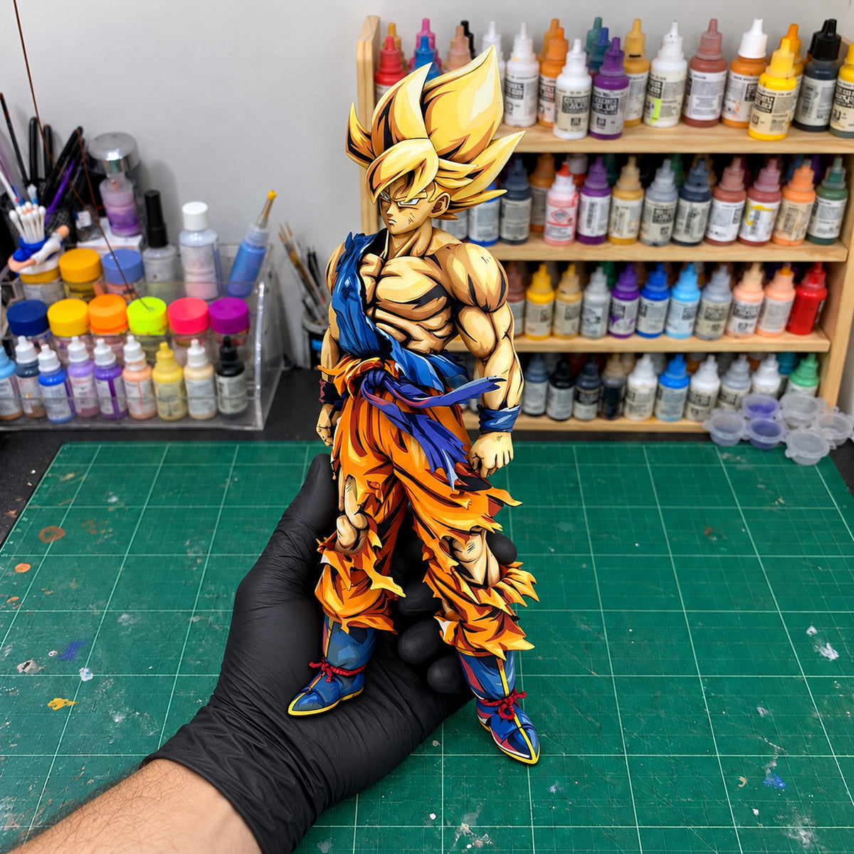 Dragon Ball Son Goku Namek Figure Repaint — held securely in one gloved hand