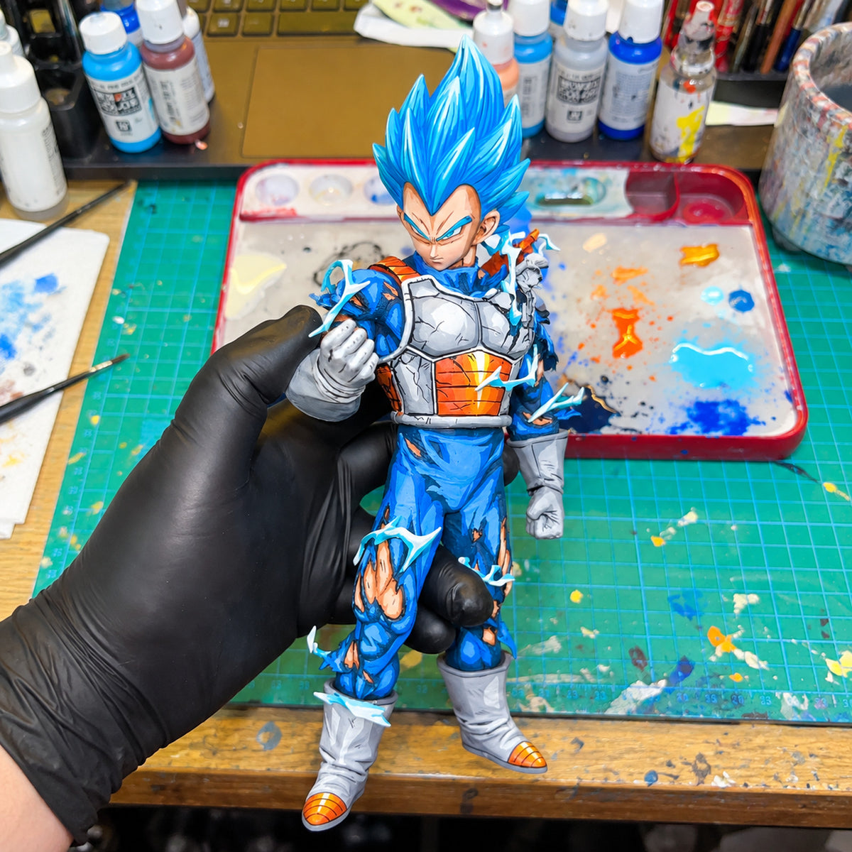 Hand-Painted Dragon Ball Super Saiyan Blue Vegeta Figure Repaint — hand or studio view