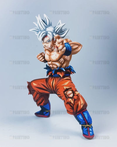 A detailed anime figurine of Goku in his Super Saiyan form, posed in a dynamic fighting stance against a light gray studio background.