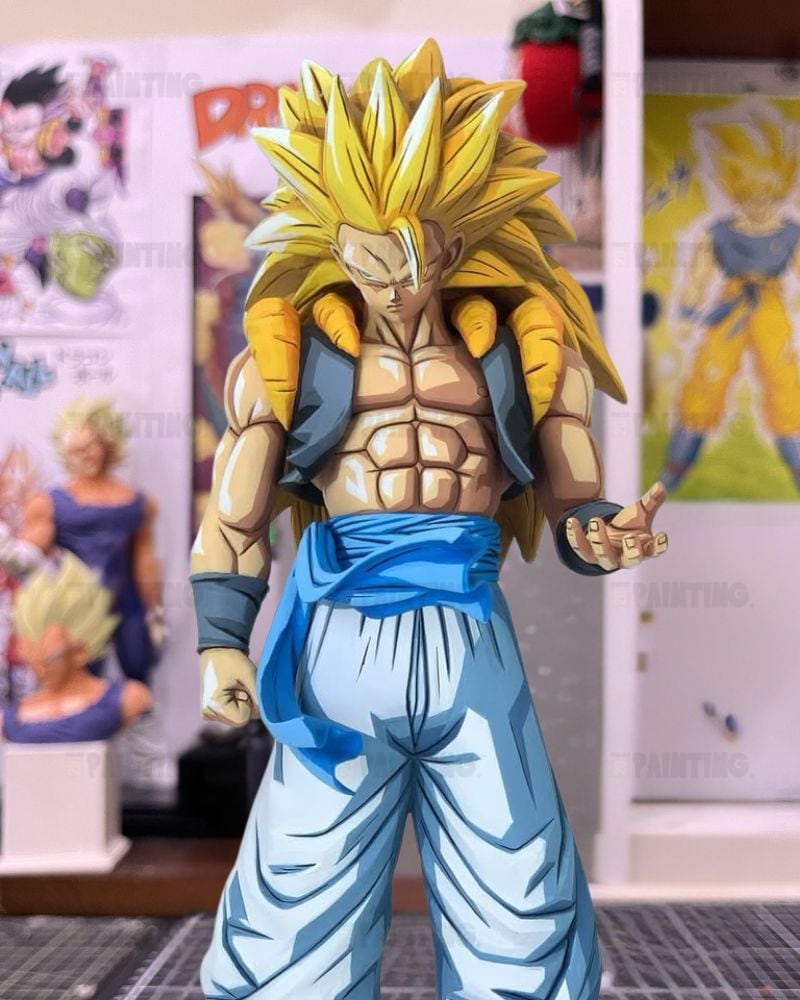 A detailed anime figurine of a Super Saiyan character with spiky yellow hair, standing in a room with Dragon Ball posters in the background.
