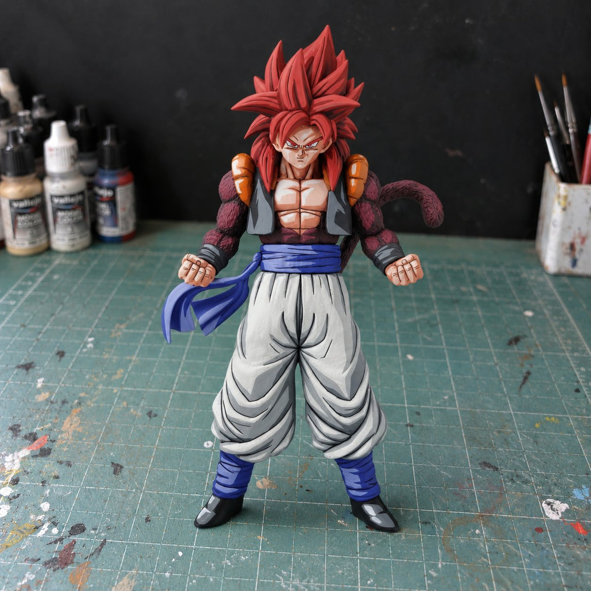 Dragon Ball GT Gogeta Super Saiyan 4 Figure Repaint — workshop view