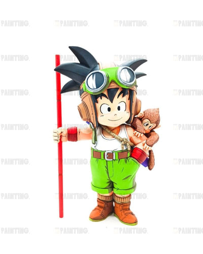A collectible figurine of a character resembling Goku wearing a green aviator helmet and goggles, holding a red staff and carrying a small monkey on his back, set against a plain white background.