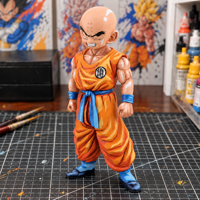 Krillin Orange Gi — hand-painted figure in artist workshop