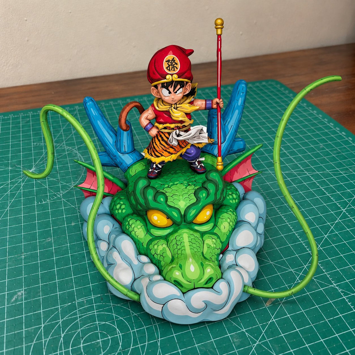 Hand-Painted Dragon Ball Kid Goku on Shenron Figure Repaint — figure in painting workshop