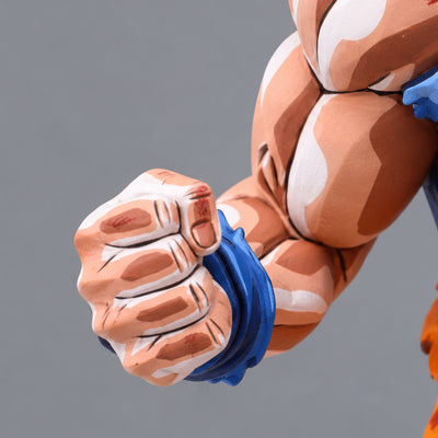 Super Saiyan Son Goku Jump 50th Anniversary Figure Repaint — right fist and blue wristband close-up, no torso or legs
