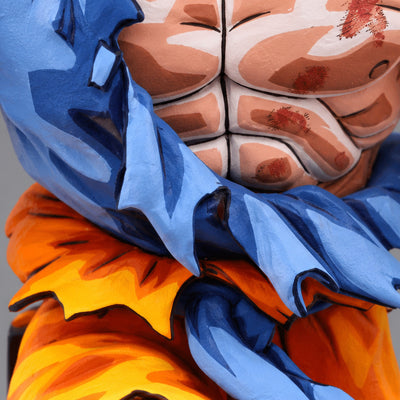 Super Saiyan Son Goku Jump 50th Anniversary Figure Repaint — Close-up of ONLY bare chest and torn blue shirt