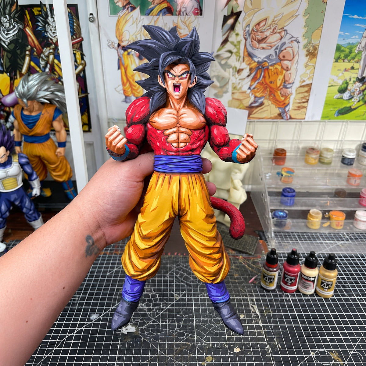 Dragon Ball GT Super Saiyan 4 Son Goku Figure Repaint — Figure in painting workshop