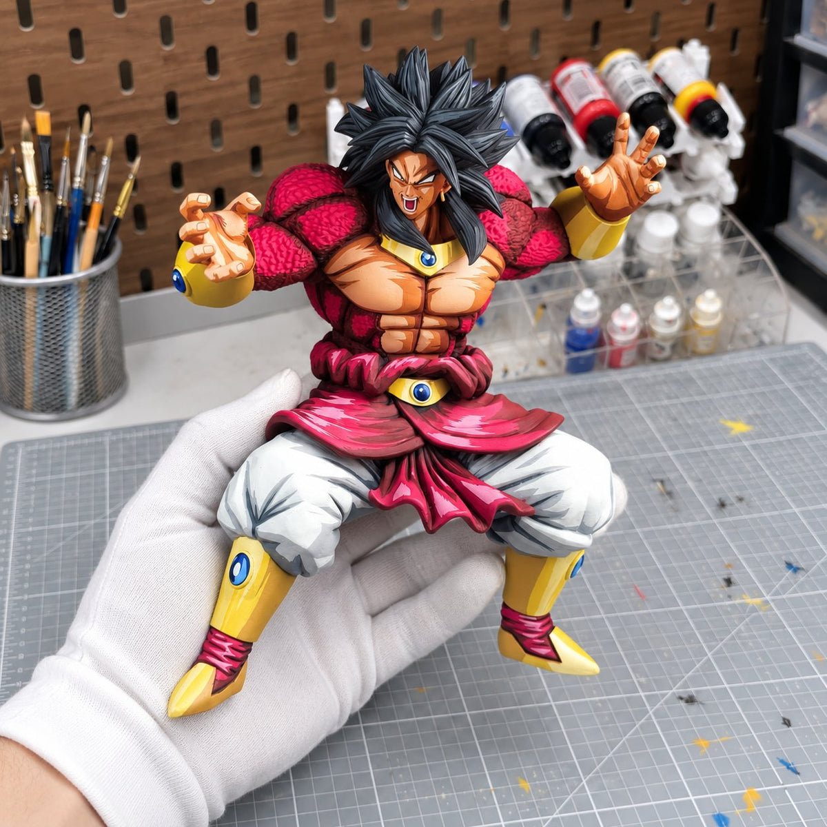 Broly Super Saiyan 4 figure repaint — matte hand-painted finish in workshop