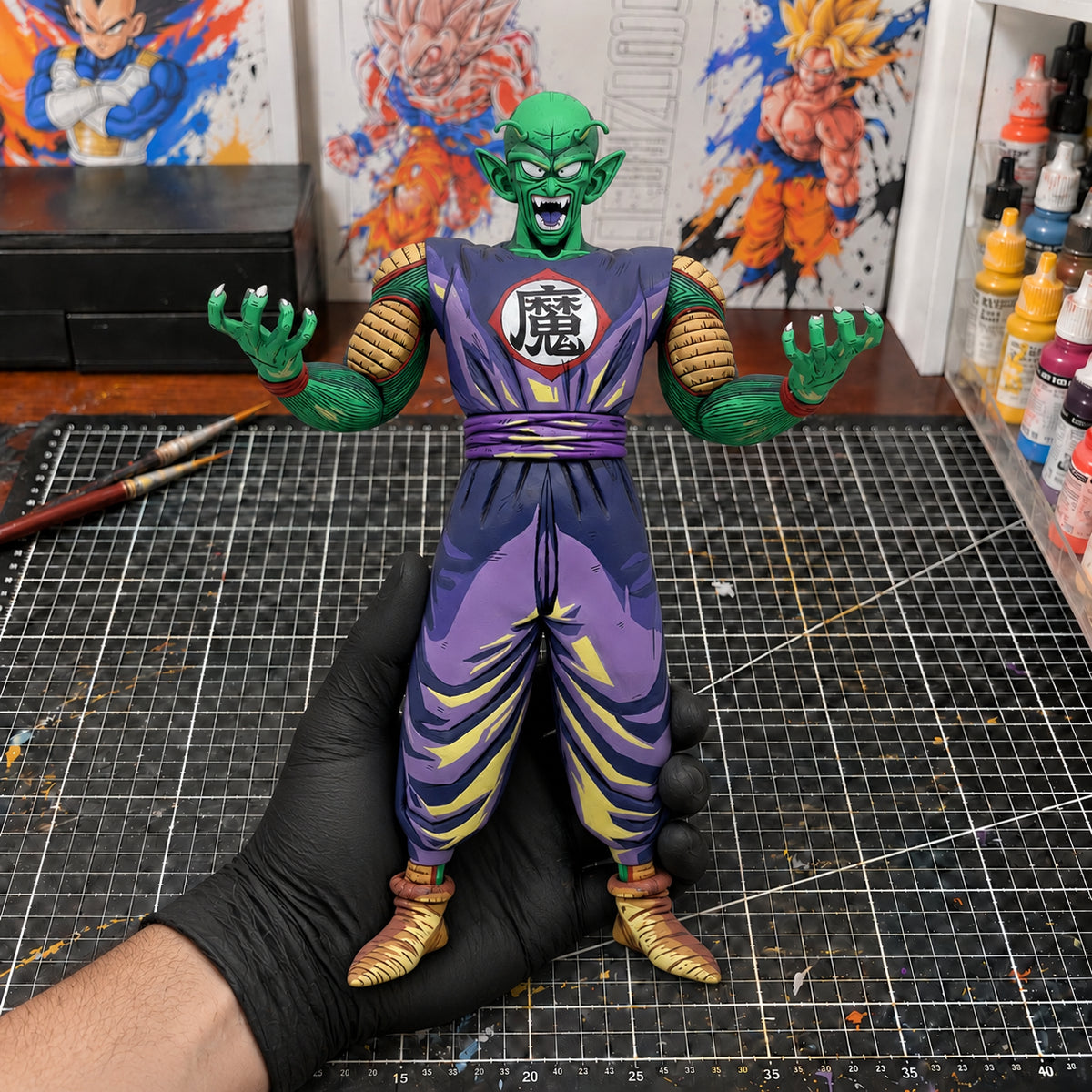 Comic Colour Dragon Ball Demon King Piccolo Figure Repaint — held securely in one gloved hand