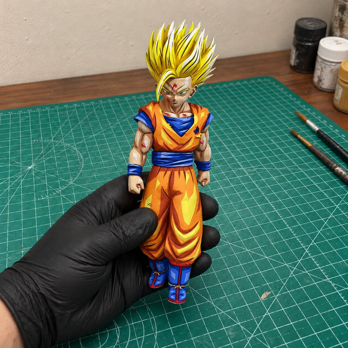Super Saiyan 2 Gohan 2D painted collectible, figure held in hand