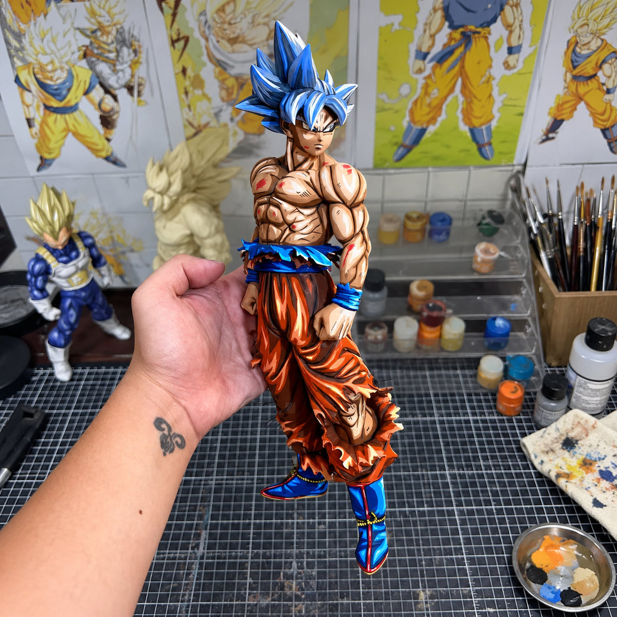 Ultra Instinct Goku 32 cm 2D painted collectible, figure held in hand