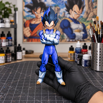Dragon Ball Z Vegeta Figure Repaint — figure held in hand in a painting workshop